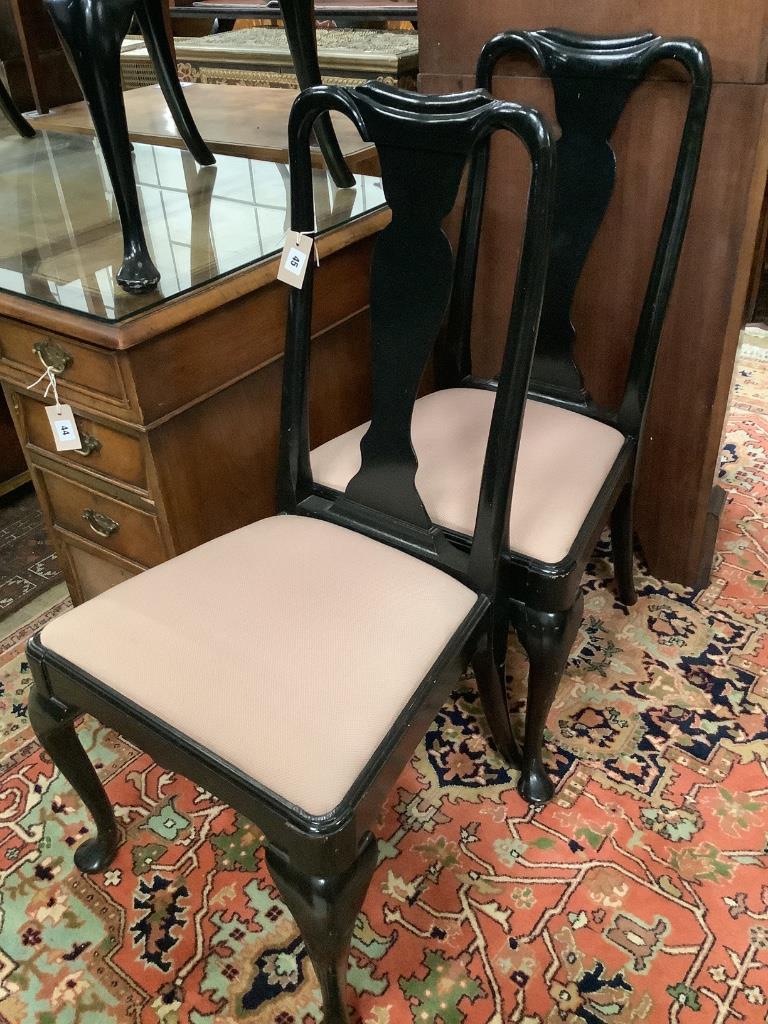 A set of six Queen Anne style ebonised dining chairs, two with arms